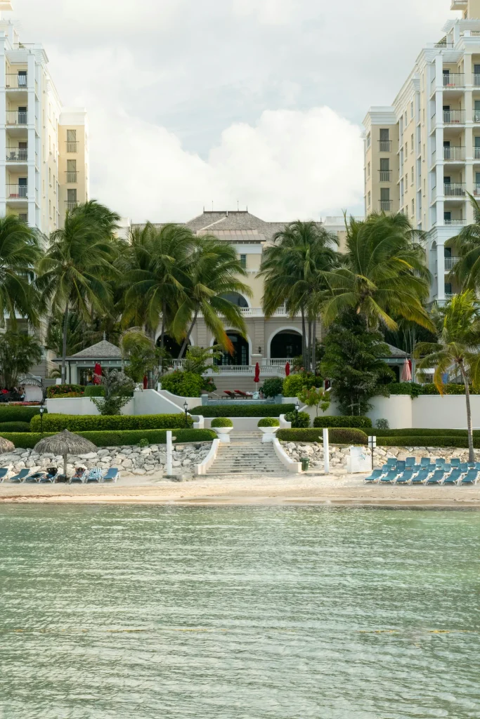 Beachfront resort with palm trees and lounge chairs in Montego Bay, Jamaica