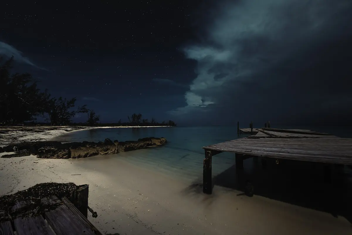 Jaws Beach in Nassau beneath a moonlit tropical sky